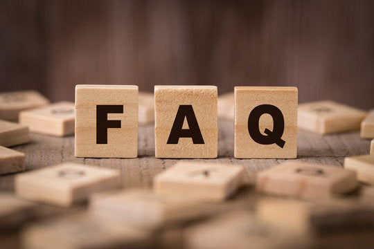 Wooden tiles spelling FAQ for AlphaGeo Ltd shop, survey equipment and drone rental UK