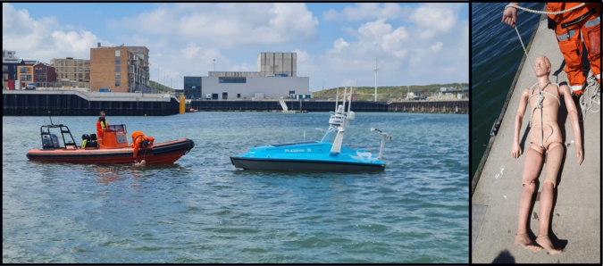 AlphaGeo unmanned surface vehicle and orange boat on water, rescue dummy on dock, harbour scene