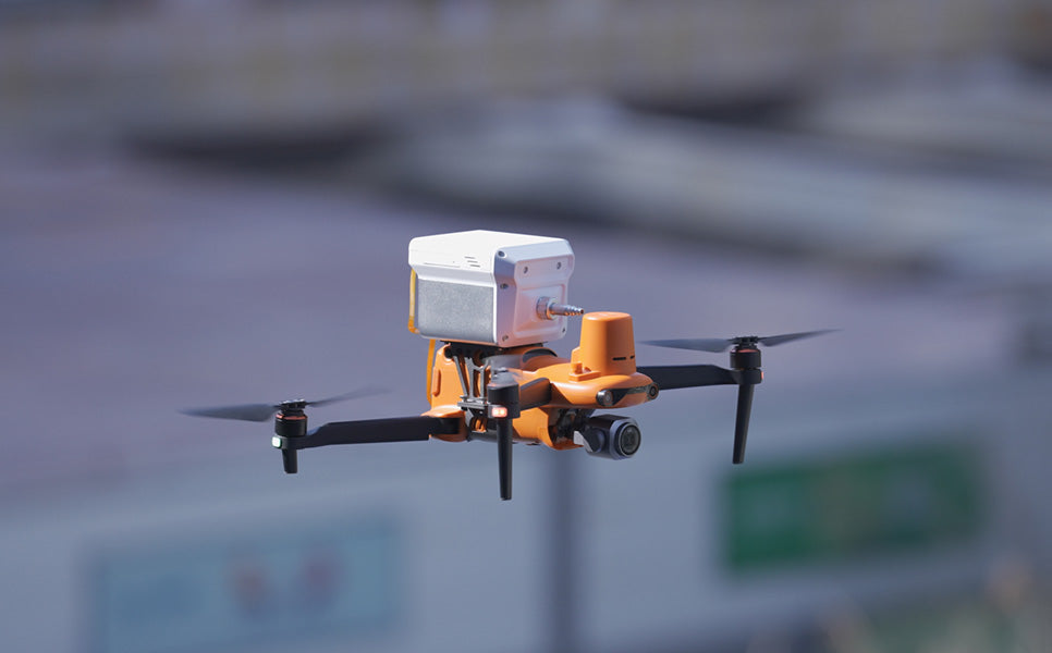 Autel EVO II drone in flight, orange commercial UAV with mounted sensor, AlphaGeo Ltd