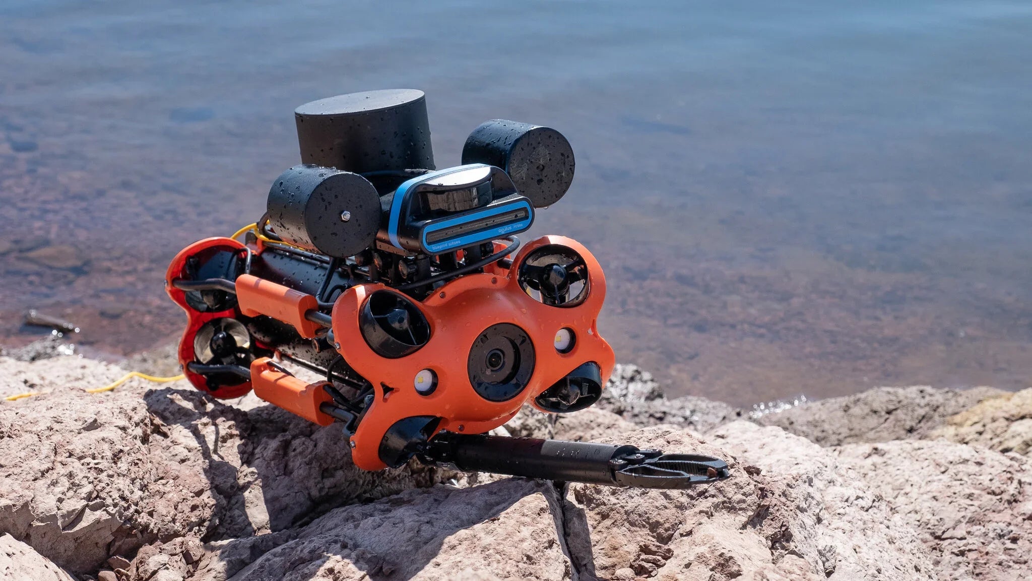 Chasing M2 ROV underwater drone on rocky shore, robotics equipment for survey, AlphaGeo Ltd