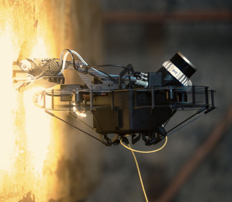 Inspection drone with mounted camera surveying a wall, AlphaGeo robotics equipment