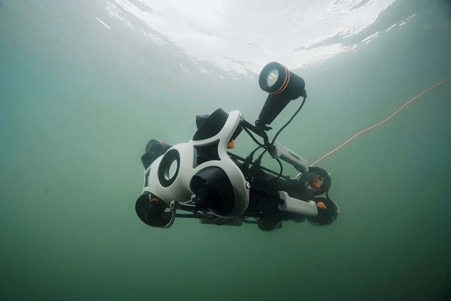 Underwater drone ROV with lights operating underwater, AlphaGeo robotics equipment